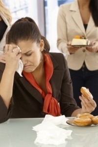 Sad woman eating donut