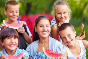 Kids eating watermelon