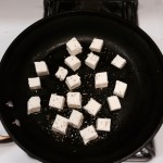 Cheese cubes in pan before