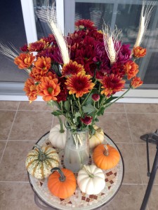 Pumpkins and flower vase